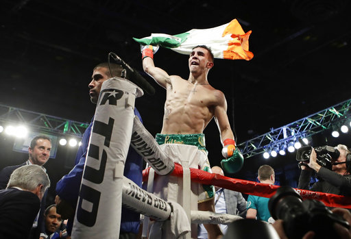 Conlan walks with McGregor, beats Ibarra in pro debut