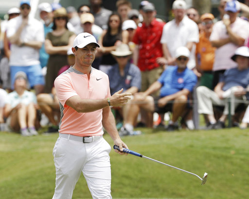 Rory McIlroy says tests show no new injury to his back