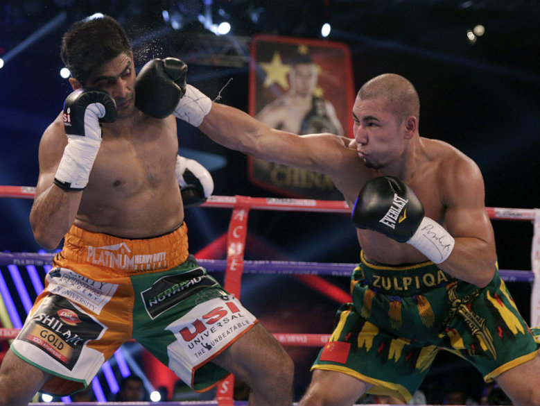 Indian boxer beats Chinese rival but doesn't want his belt